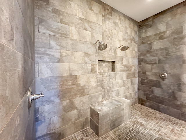 bathroom with tiled shower