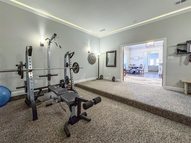 exercise room featuring ornamental molding