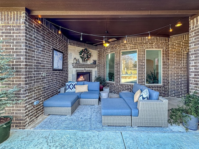 view of patio / terrace with an outdoor living space with a fireplace