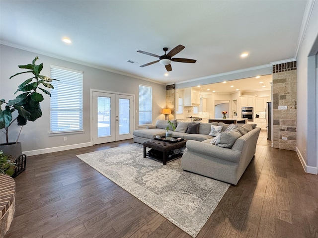 living room with crown molding, dark hardwood / wood-style floors, french doors, and ceiling fan