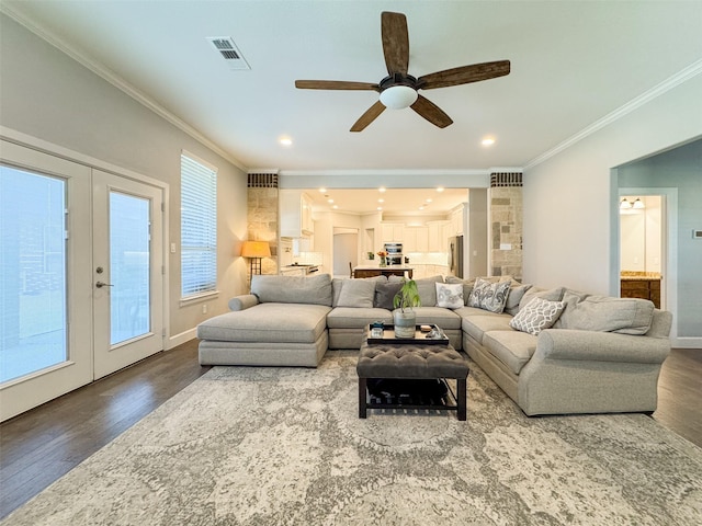 living room featuring crown molding, ceiling fan, hardwood / wood-style floors, and french doors