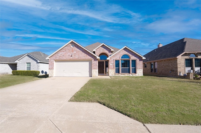 ranch-style home with a garage and a front yard