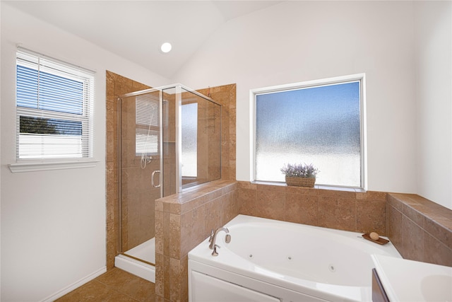 bathroom with plus walk in shower, lofted ceiling, and a healthy amount of sunlight