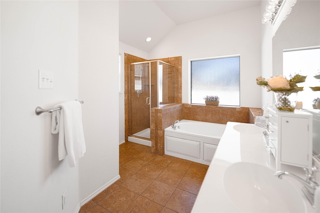 bathroom featuring lofted ceiling, plus walk in shower, tile patterned flooring, and vanity