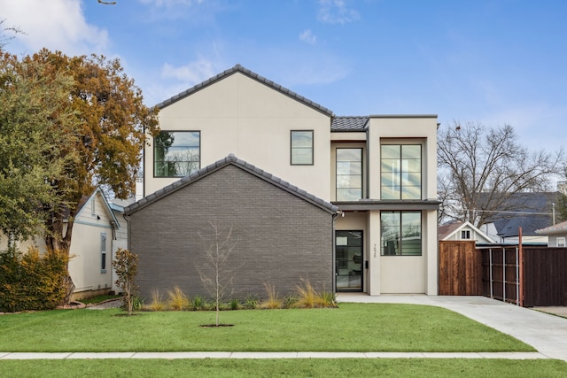 back of house with a lawn