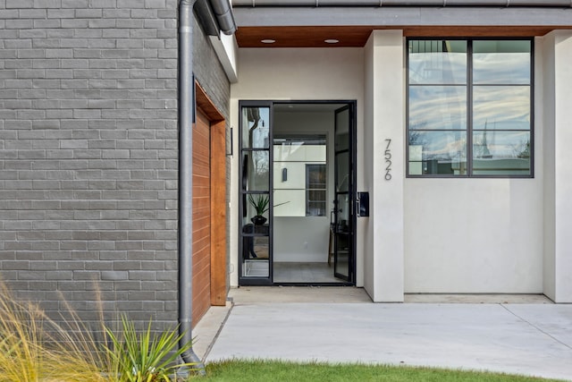 entrance to property featuring a patio area