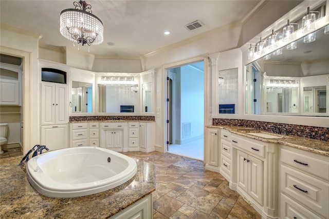 bathroom with vanity, a washtub, a notable chandelier, toilet, and crown molding