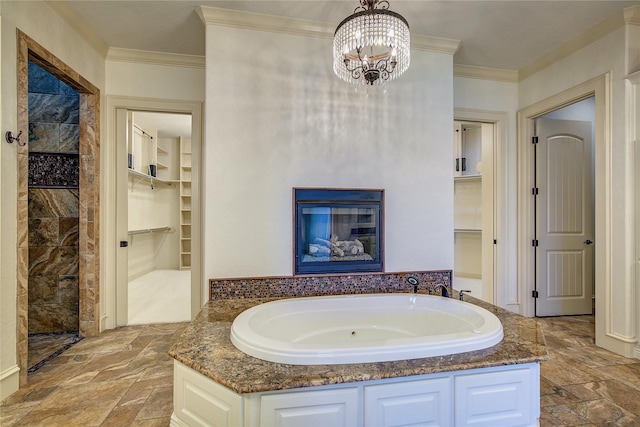 bathroom featuring ornamental molding, separate shower and tub, built in features, and an inviting chandelier