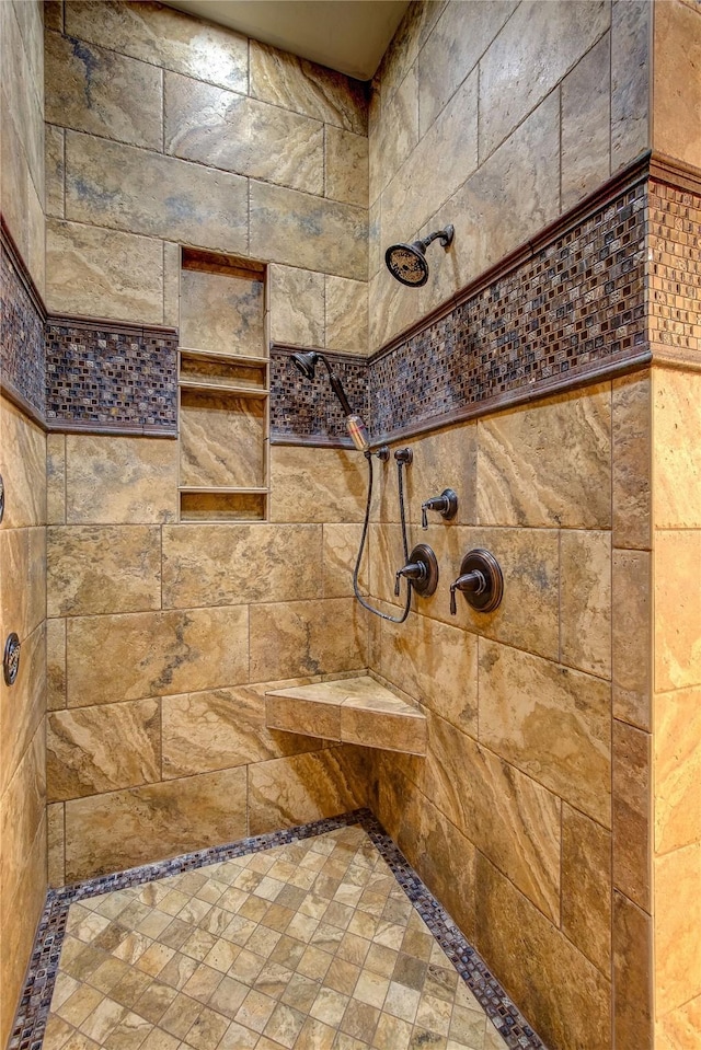 bathroom with tiled shower