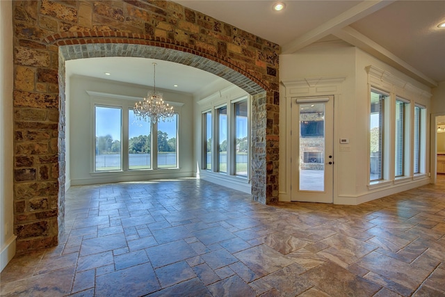 interior space with plenty of natural light and a chandelier