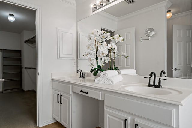 bathroom featuring vanity and ornamental molding