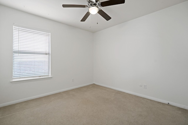 unfurnished room featuring light carpet and ceiling fan