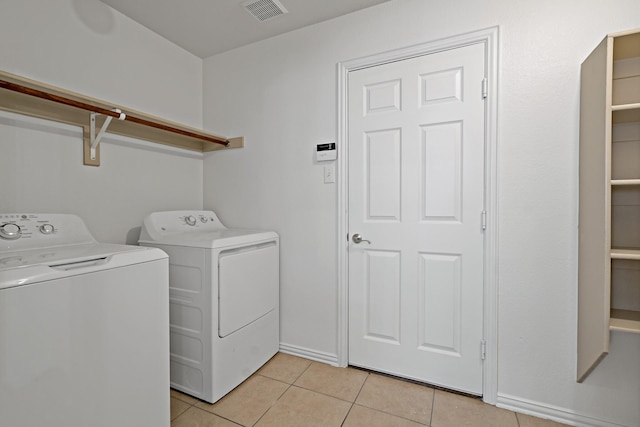 washroom with light tile patterned flooring and separate washer and dryer