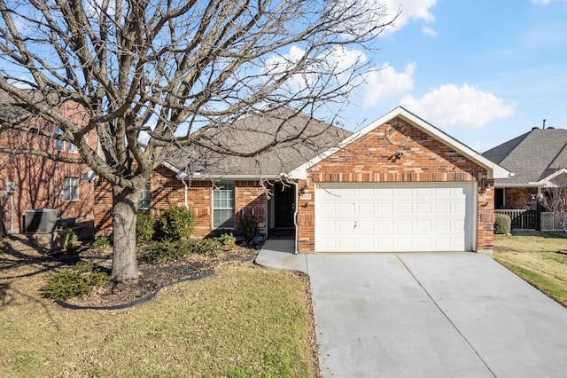 view of front of house with a garage, central AC unit, and a front yard