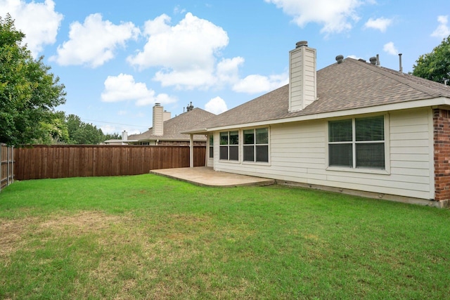 back of property featuring a yard and a patio area