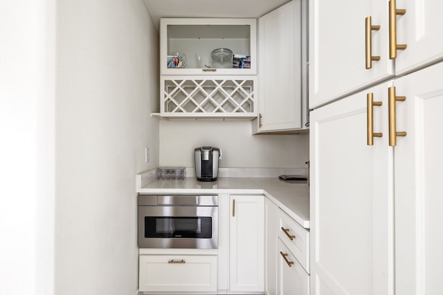 bar with oven and white cabinets