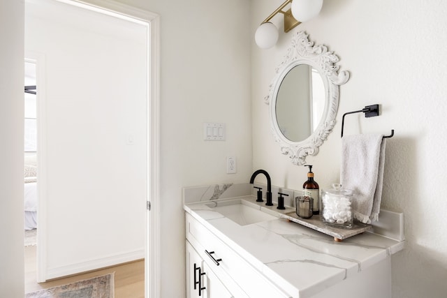 bathroom with vanity and wood-type flooring