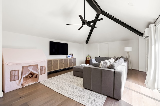 living area featuring lofted ceiling with beams, ceiling fan, wood finished floors, and a wall mounted air conditioner