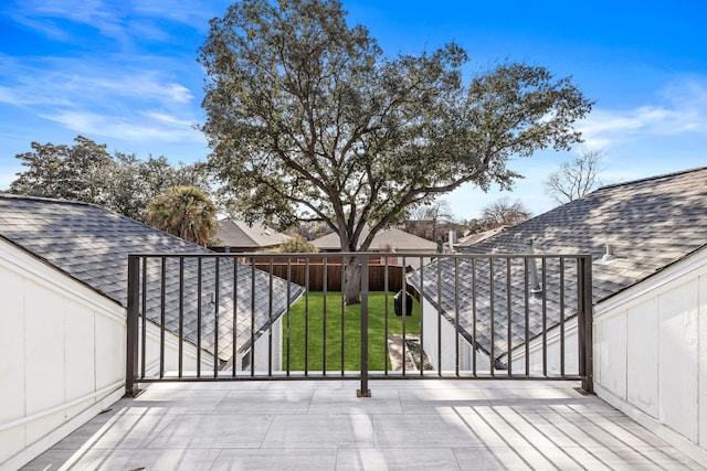 view of gate featuring a yard and fence