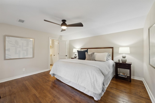 bedroom with dark hardwood / wood-style flooring and ceiling fan