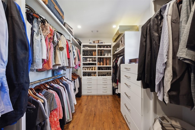 walk in closet with light wood-type flooring