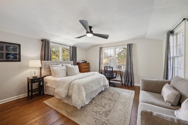 bedroom featuring lofted ceiling, dark hardwood / wood-style flooring, and ceiling fan