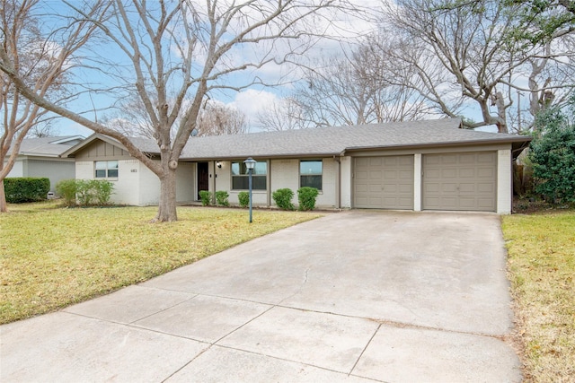 single story home featuring a garage and a front yard