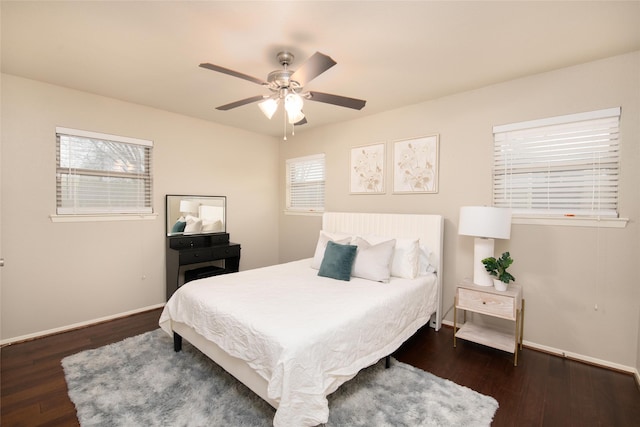 bedroom featuring dark hardwood / wood-style flooring and ceiling fan