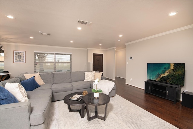 living room with crown molding and dark hardwood / wood-style flooring