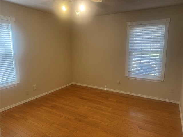 unfurnished room with light hardwood / wood-style floors