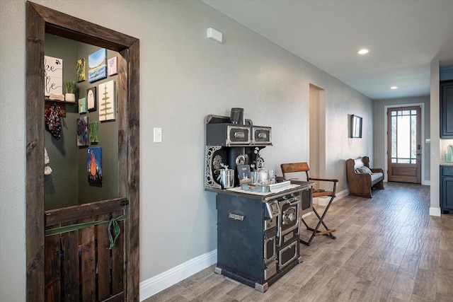 entrance foyer with recessed lighting, baseboards, and wood finished floors