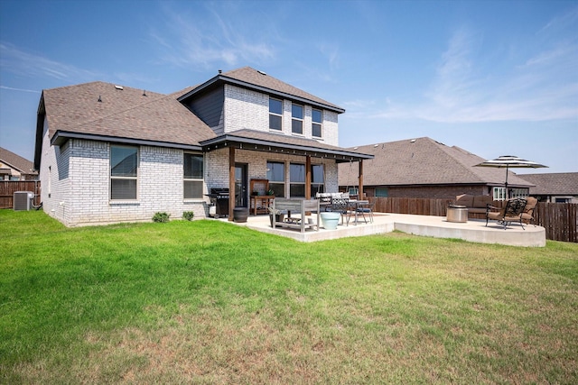 back of house featuring a yard, a patio, and central air condition unit