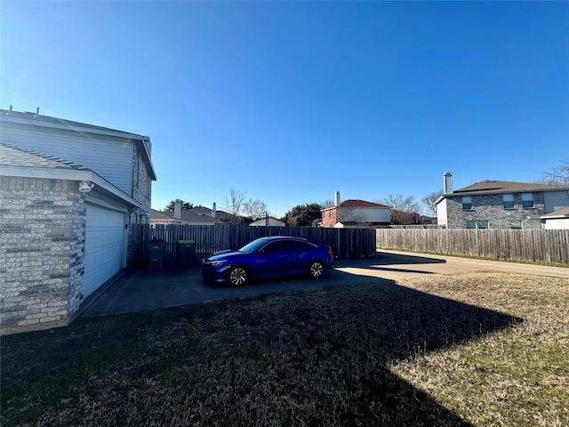 view of yard with a garage