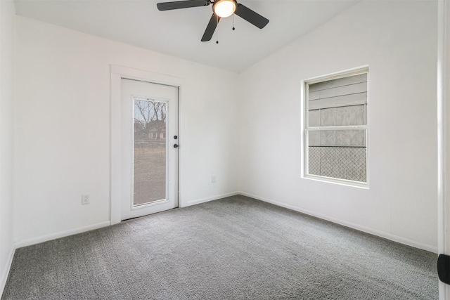 unfurnished room featuring ceiling fan, lofted ceiling, and carpet flooring