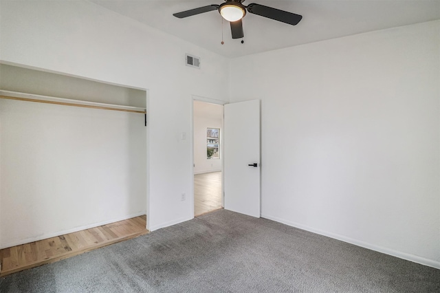 unfurnished bedroom with a closet, ceiling fan, and carpet