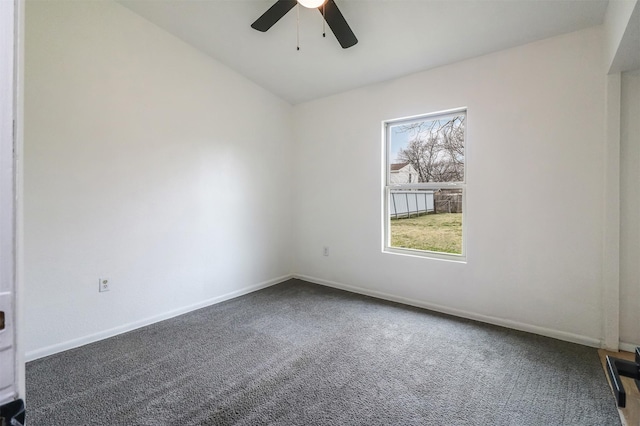 unfurnished room featuring vaulted ceiling, carpet floors, and ceiling fan