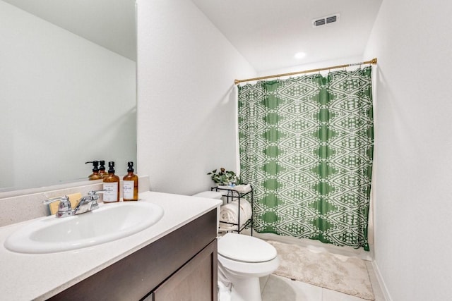 bathroom with vanity, curtained shower, tile patterned floors, and toilet