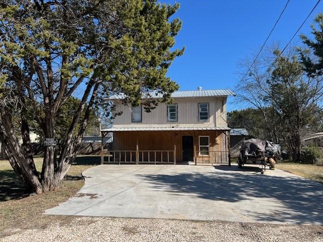 view of front of home featuring a carport