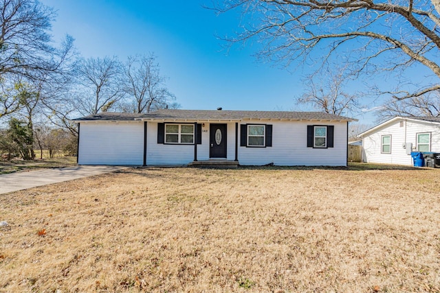 ranch-style home with a front lawn