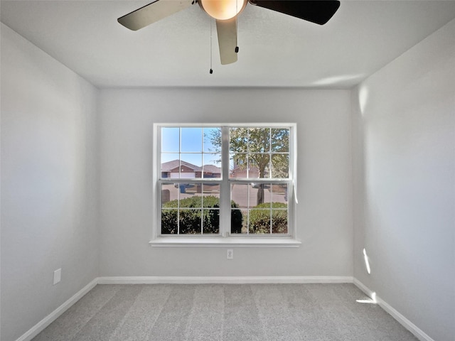 carpeted empty room with a healthy amount of sunlight