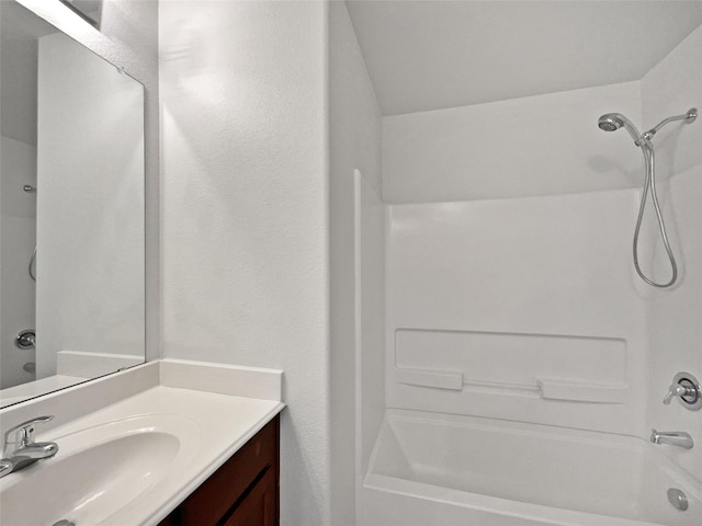 bathroom featuring vanity and shower / bathtub combination