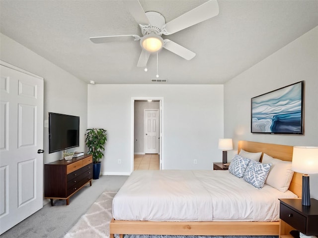 carpeted bedroom featuring ceiling fan