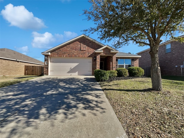 view of front of property with a garage and a front yard