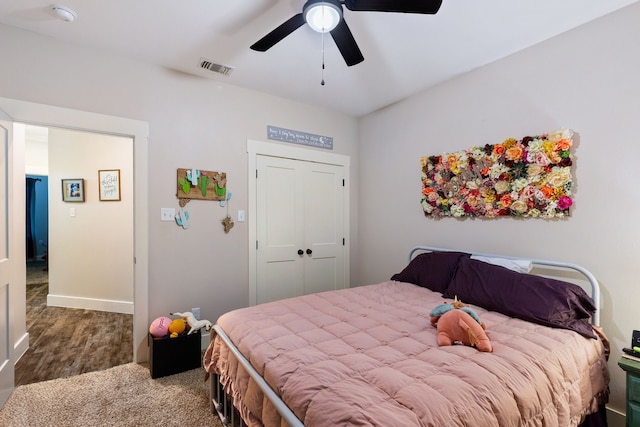 bedroom featuring hardwood / wood-style floors, a closet, and ceiling fan