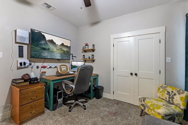 carpeted office with ceiling fan