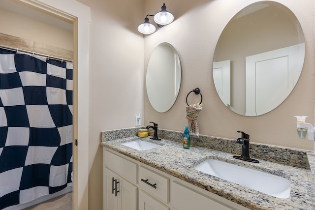 bathroom with vanity and a shower with curtain