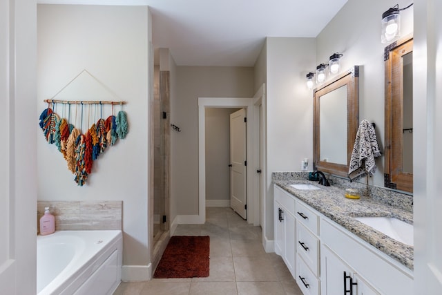 bathroom with tile patterned flooring, vanity, and independent shower and bath