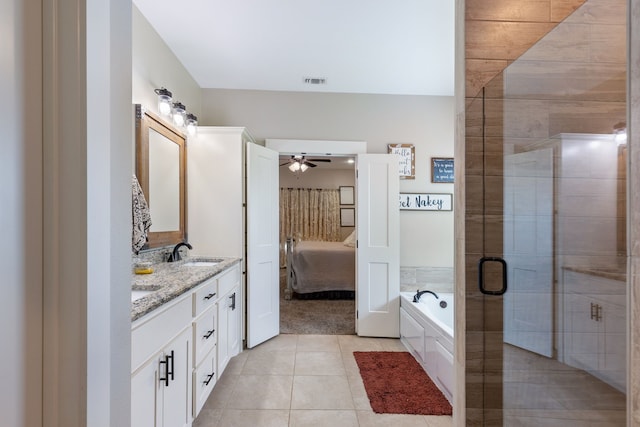 bathroom with ceiling fan, tile patterned floors, shower with separate bathtub, and vanity