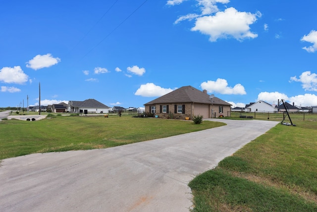 single story home featuring a front lawn