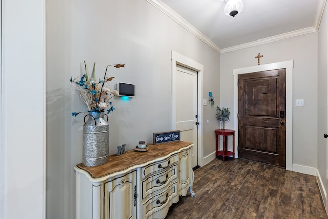 entryway with dark wood-type flooring and ornamental molding